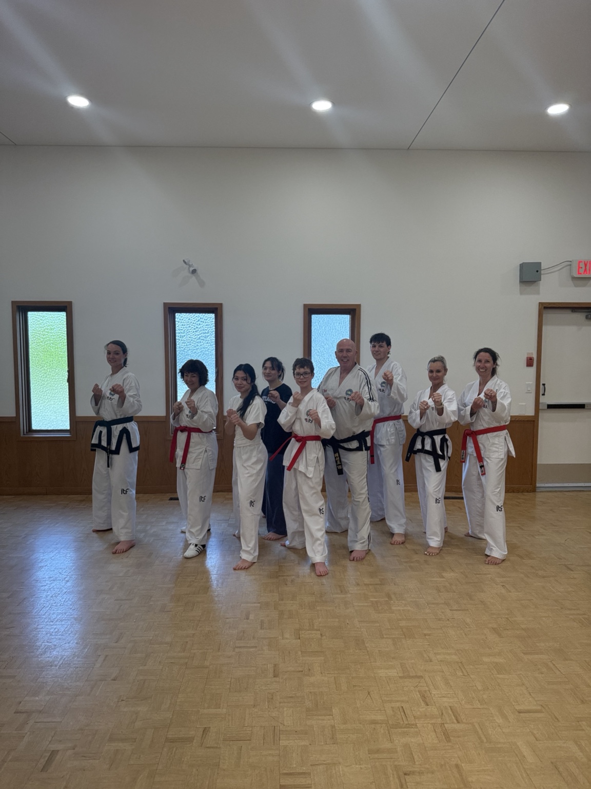 Impact Martial Arts students training together in class